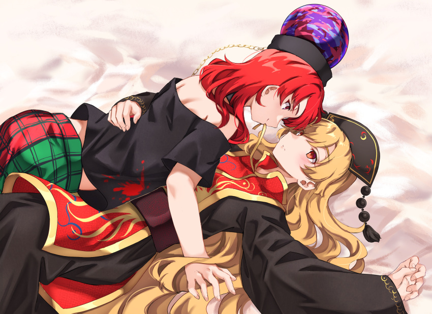 2girls bare_shoulders bed_sheet black_dress black_shirt blonde_hair blush chain chinese_clothes closed_mouth dress eye_contact girl_on_top gold_chain hair_between_eyes hat hecatia_lapislazuli highres junko_(touhou) long_hair long_sleeves looking_at_another lying lying_on_person multicolored_clothes multicolored_skirt multiple_girls neold off-shoulder_shirt off_shoulder on_back red_eyes red_hair red_tabard shirt skirt smile t-shirt tabard touhou underworld_(ornament) very_long_hair wide_sleeves yuri