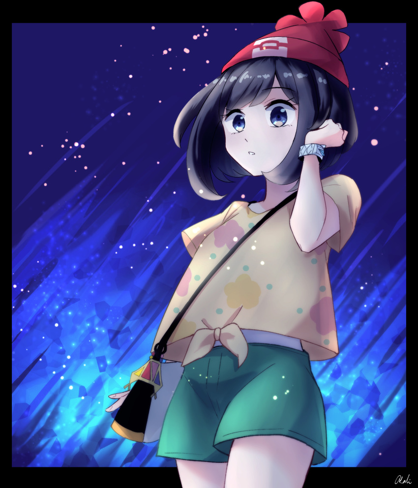 1girl bag bangs beanie black_border black_hair blue_eyes border bracelet commentary cowboy_shot eyelashes floral_print green_shorts hand_up hat highres jewelry parted_lips pokemon pokemon_(game) pokemon_sm red_headwear selene_(pokemon) shirt short_shorts short_sleeves shorts shoulder_bag signature solo t-shirt tere_asahi tied_shirt yellow_shirt z-ring