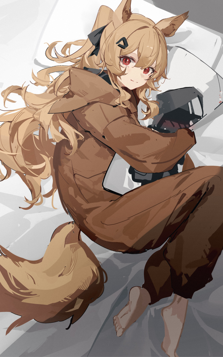 1girl absurdres animal_ears arknights bangs barefoot bed_sheet brown_hair cameo ceobe_(arknights) closed_mouth dakimakura_(object) doctor_(arknights) dog_ears dog_girl dog_tail from_above hair_ornament hairclip highres hood hood_down long_hair long_sleeves looking_at_viewer looking_up luozhou_pile lying object_hug official_alternate_costume on_bed on_side onesie pillow ponytail red_eyes smile solo tail very_long_hair