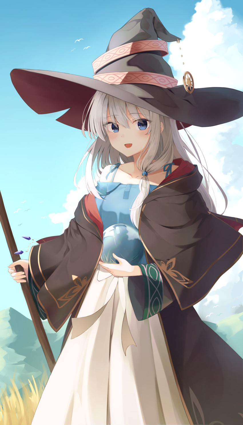 1girl absurdres bangs bird black_capelet black_coat black_headwear blue_dress capelet cloud coat commentary crystal_ball day dress elaina_(majo_no_tabitabi) eyebrows_visible_through_hair grey_hair hair_between_eyes hat highres holding long_sleeves looking_at_viewer majo_no_tabitabi open_mouth opm7760 outdoors smile solo standing two-tone_dress white_dress wide_sleeves witch_hat