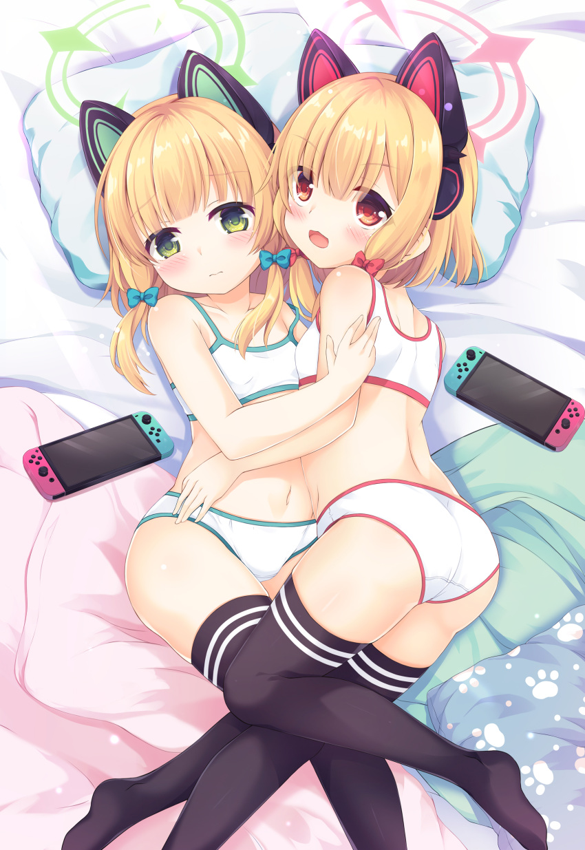 2girls :d absurdres animal_ear_headphones animal_ears ass bangs bare_arms bare_shoulders bed_sheet black_legwear blonde_hair blue_archive blue_bow blush bow bra breasts closed_mouth commentary_request eyebrows_visible_through_hair fake_animal_ears green_eyes hair_between_eyes hair_bow highres long_hair looking_at_viewer lying midori_(blue_archive) momoi_(blue_archive) multiple_girls navel nintendo_switch no_shoes on_back on_side panties pillow red_bow red_eyes sakuraba_hikaru_(loveindog) siblings sisters small_breasts smile soles thighhighs twins underwear wavy_mouth white_bra white_panties