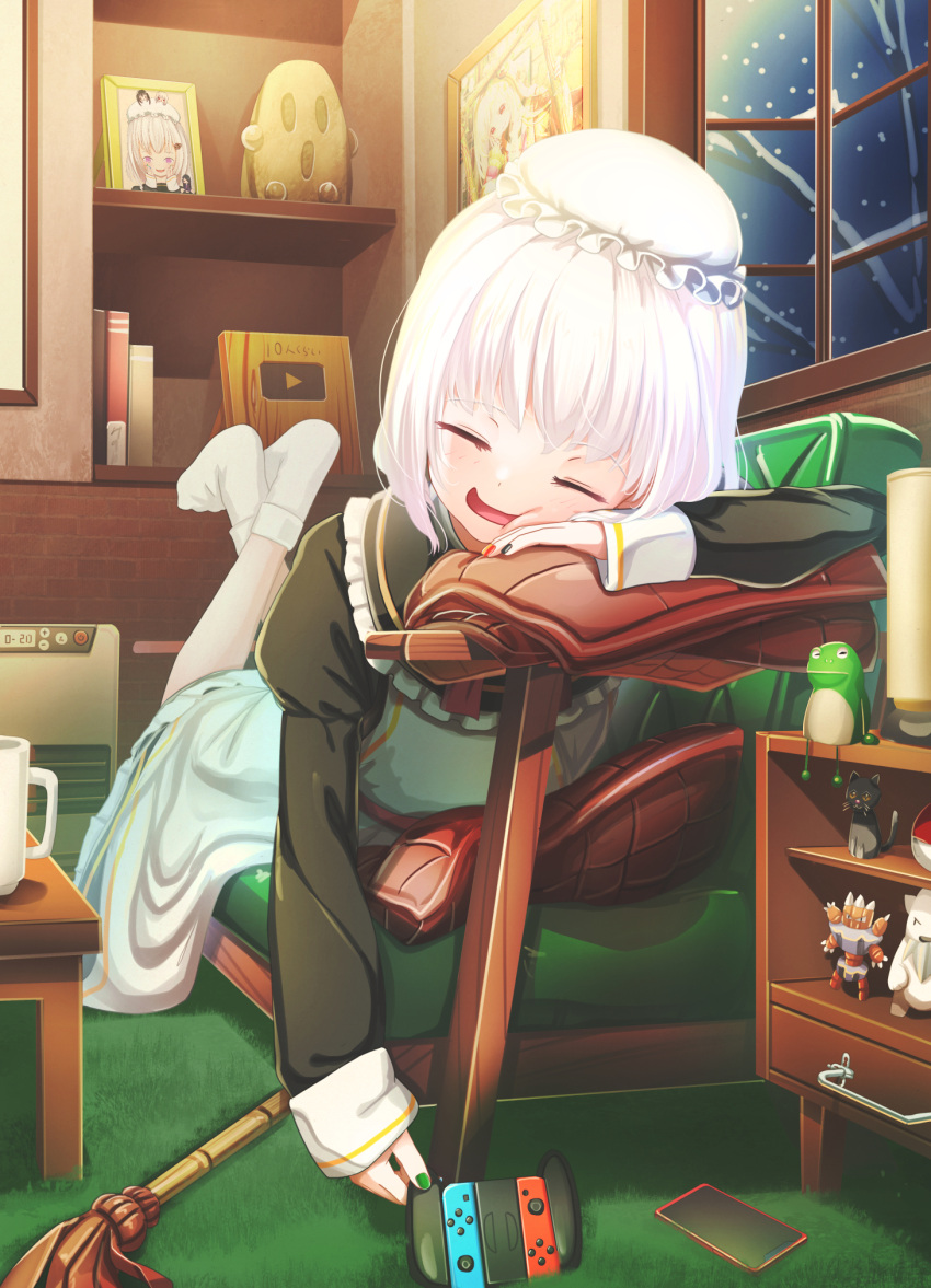 1girl :d abo_(kawatasyunnnosukesabu) arm_rest cat cellphone closed_eyes couch duster figure frog haniwa_(statue) hat highres indoors legs_up lying maid mob_cap nail_polish nintendo_switch on_stomach original phone smartphone smile snowing socks solo translated white_hair white_legwear window youtube_creator_award