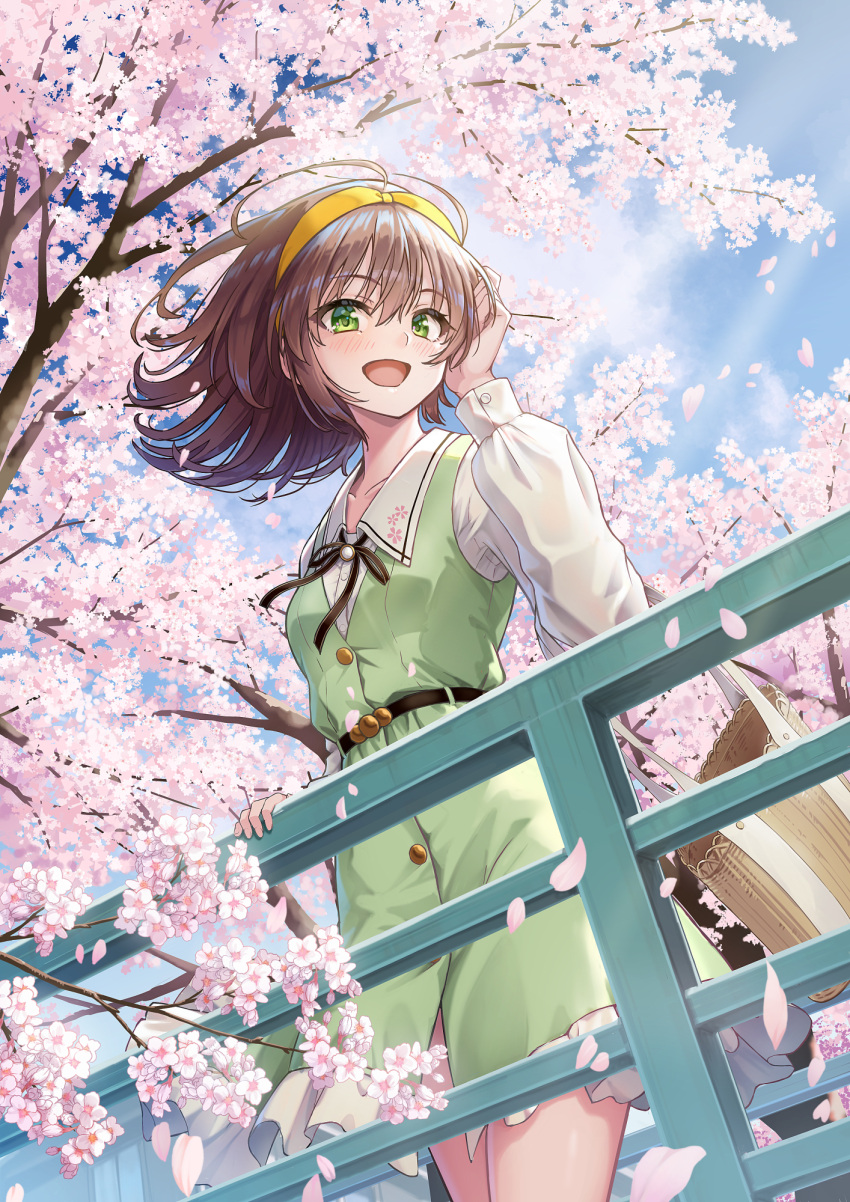 1girl against_railing belt blue_sky brown_hair cherry_blossoms cloud dress frilled_dress frills from_below green_dress green_eyes hairband hand_on_railing highres holding long_sleeves looking_to_the_side macha0331 medium_hair open_mouth original outdoors railing shirt sky smile white_shirt yellow_hairband