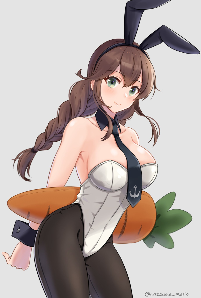 1girl animal_ears black_legwear braid breasts brown_hair carrot carrot_pillow collarbone covered_navel cowboy_shot detached_collar eyebrows_visible_through_hair fake_animal_ears green_eyes hair_between_eyes highres kantai_collection large_breasts leotard looking_at_viewer natsume_(natsume_melio) necktie noshiro_(kancolle) pantyhose playboy_bunny rabbit_ears simple_background solo strapless strapless_leotard twin_braids twitter_username white_background white_leotard wrist_cuffs