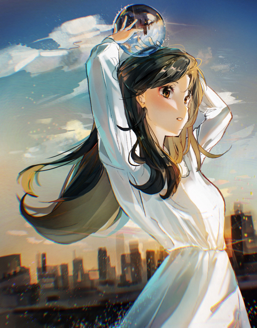 1girl arms_up ball bangs black_hair blurry blurry_background blush breasts brown_eyes chromatic_aberration city cloud commentary crystal_ball day dress eyebrows_visible_through_hair floating_hair highres long_hair long_sleeves looking_away original outdoors parted_lips rokku skyline small_breasts solo upper_body white_dress