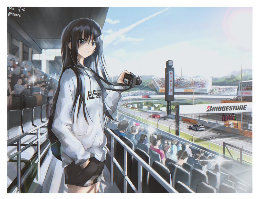 1girl akiyama_mio black_eyes black_hair black_shorts bridgestone camera eyebrows_visible_through_hair grin hand_in_pocket highres holding holding_camera k-on! long_hair looking_at_viewer outdoors parted_lips race_vehicle racetrack scenery shorts smile teeth torzee