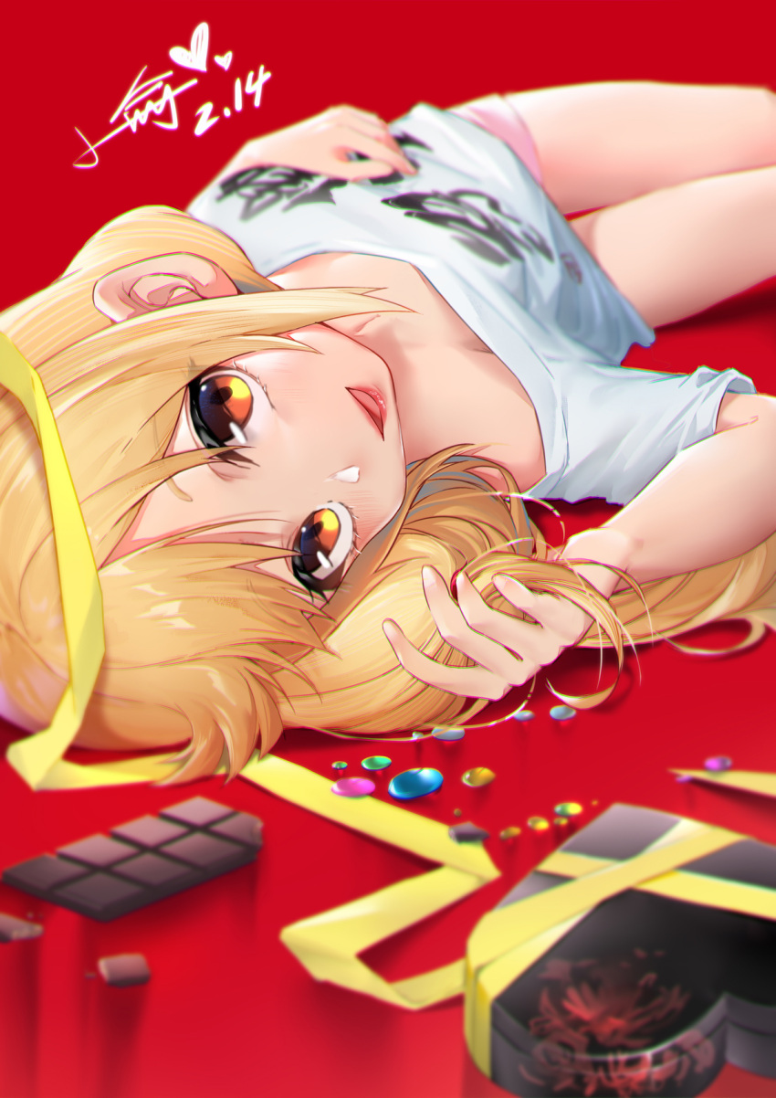 1girl arm_up bangs bare_shoulders blonde_hair box brown_eyes candy chocolate chocolate_bar commentary_request eyebrows_visible_through_hair food futaba_anzu gift gift_box hand_in_hair heart-shaped_box highres idolmaster idolmaster_cinderella_girls long_hair looking_at_viewer low_twintails lying off_shoulder on_back parted_lips pink_shorts red_background red_lips shirt short_shorts short_sleeves shorts smile solo twintails valentine white_shirt xiaoyu