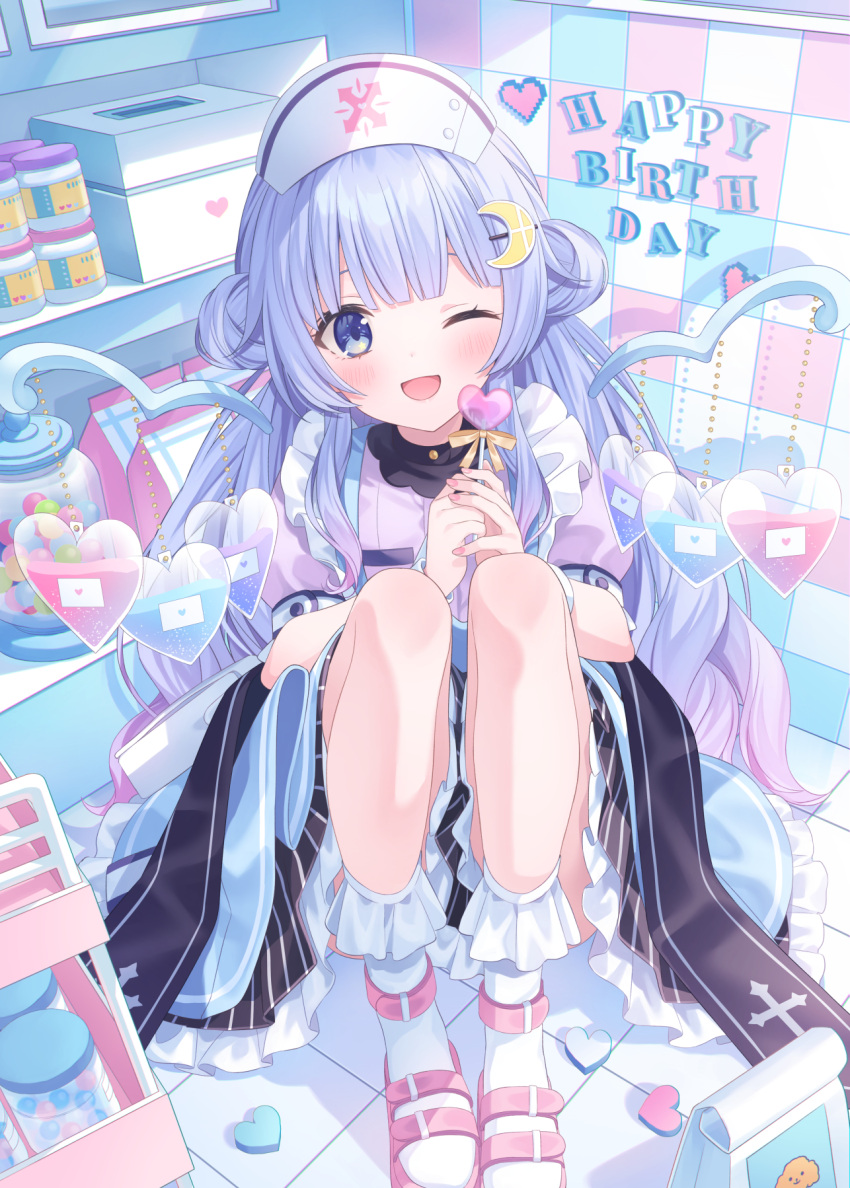 blue_eyes blue_hair blush box candy crescent crescent_hair_ornament food hair_ornament happy_birthday hat highres jimmy_madomagi long_hair looking_at_viewer medicine mirutani_nia noripro nurse nurse_cap one_eye_closed open_mouth pill sandals shelf sitting