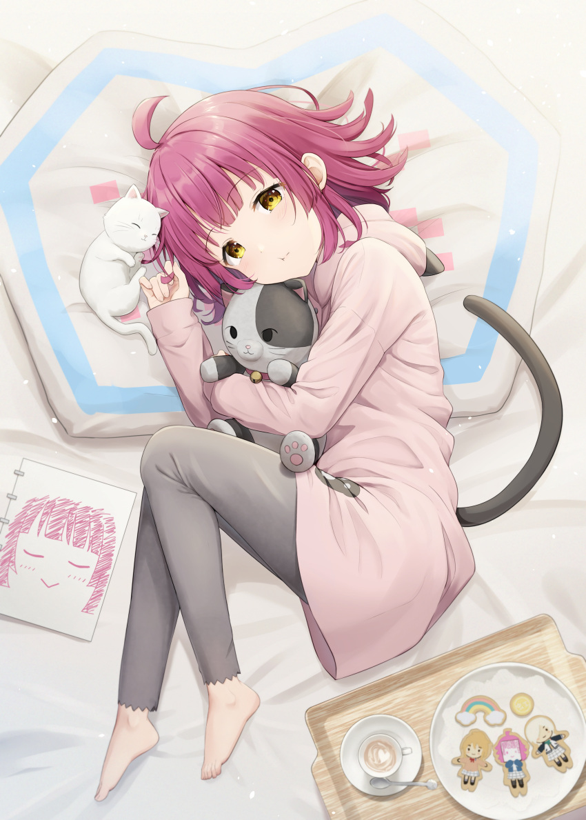 1girl absurdres ahoge animal_hood barefoot black_pants blunt_bangs blunt_ends cat cat_hood cat_tail character_cookie commentary cookie cup dot_nose drawing_(object) fake_tail feet food hanpen_(nijigasaki) highres holding holding_stuffed_toy hood hoodie latte_art light_blush long_sleeves looking_at_viewer love_live! love_live!_nijigasaki_high_school_idol_club lying medium_hair mia_taylor miyashita_ai on_bed pants pink_hair pink_hoodie puffy_cheeks rina-chan_board saucer sidelocks spoon stuffed_animal stuffed_cat stuffed_toy tail teacup tennoji_rina toenails toes tray white_cat yellow_eyes yutuki_ame