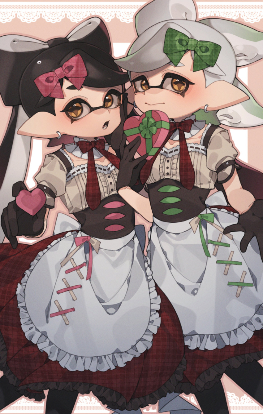 +_+ 2girls absurdres apron back_bow bangs black_bow black_bowtie black_dress black_gloves black_hair black_legwear bow bowtie box brown_eyes callie_(splatoon) closed_mouth commentary cousins dress earrings english_text frilled_apron frills gift gift_box gloves green_bow green_bowtie grey_hair hair_bow heart-shaped_box highres holding holding_gift jewelry long_hair looking_at_viewer marie_(splatoon) medium_dress medium_hair mole mole_under_eye multiple_girls open_mouth pantyhose pointy_ears prat_rat purple_bow short_sleeves side-by-side skirt_hold smile splatoon_(series) standing swept_bangs tentacle_hair tied_hair valentine very_long_hair waist_apron white_apron white_bow