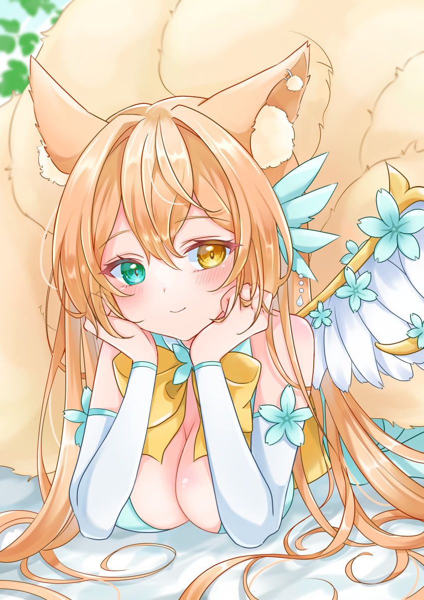 1girl absurdres animal_ear_fluff animal_ears bangs blush bow breasts character_request cleavage commentary commission detached_sleeves earrings elbow_rest eyebrows_visible_through_hair flower green_eyes hair_between_eyes head_rest heterochromia highres indie_virtual_youtuber jewelry leaf long_hair looking_at_viewer lying medium_breasts multiple_tails null_maru on_stomach orange_hair ornament skeb_commission smile solo tail virtual_youtuber wings yellow_bow yellow_eyes