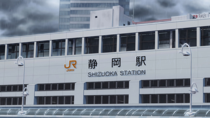 building city cityscape cloud cloudy_sky commentary_request grey_sky highres isbeyvan japan lamppost no_humans original outdoors rain scenery shizuoka_prefecture sky train_station window