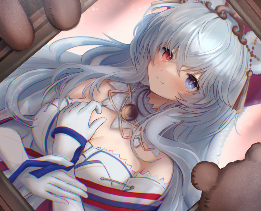 1girl 3_(sanyako1) animal_ears arknights bangs bare_shoulders bear_ears blue_eyes blush breasts cleavage closed_mouth detached_collar dress elbow_gloves eyebrows_visible_through_hair gloves hand_on_own_chest heterochromia highres long_hair looking_at_viewer medium_breasts off-shoulder_dress off_shoulder official_alternate_costume painting_(object) picture_frame red_eyes rosa_(arknights) rosa_(masterpiece)_(arknights) silver_hair smile solo stuffed_animal stuffed_toy tassel teddy_bear upper_body very_long_hair white_dress white_gloves