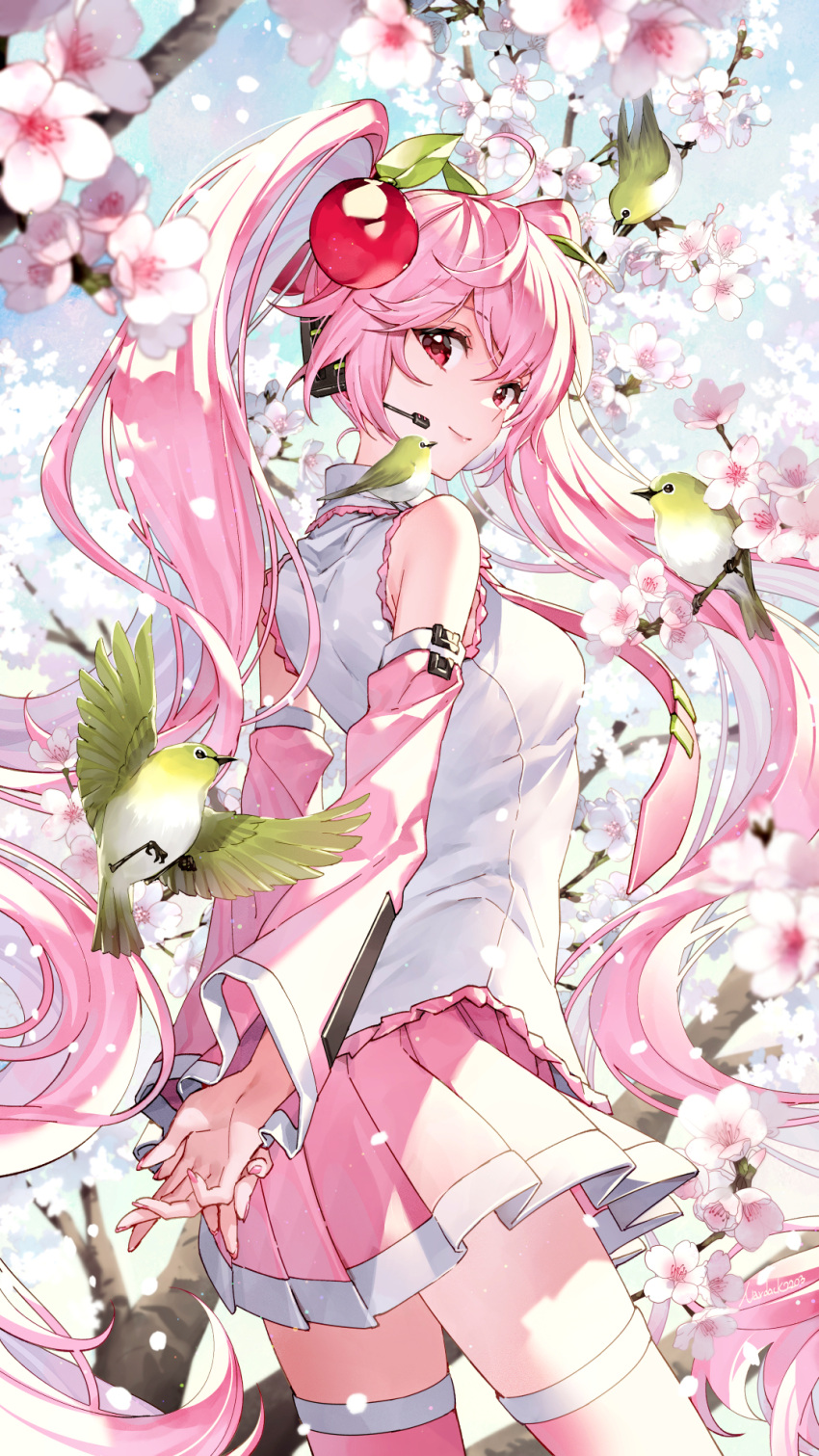 1girl ahoge arms_behind_back bird cherry_blossoms cherry_hair_ornament closed_mouth commentary_request detached_sleeves fingernails flower food-themed_hair_ornament from_behind hair_ornament hatsune_miku highres light_brown_hair long_hair looking_at_viewer nardack necktie petals pink_hair pink_legwear pink_nails pink_necktie pleated_skirt red_eyes sakura_miku skirt smile solo thighhighs thighs very_long_hair vocaloid zettai_ryouiki