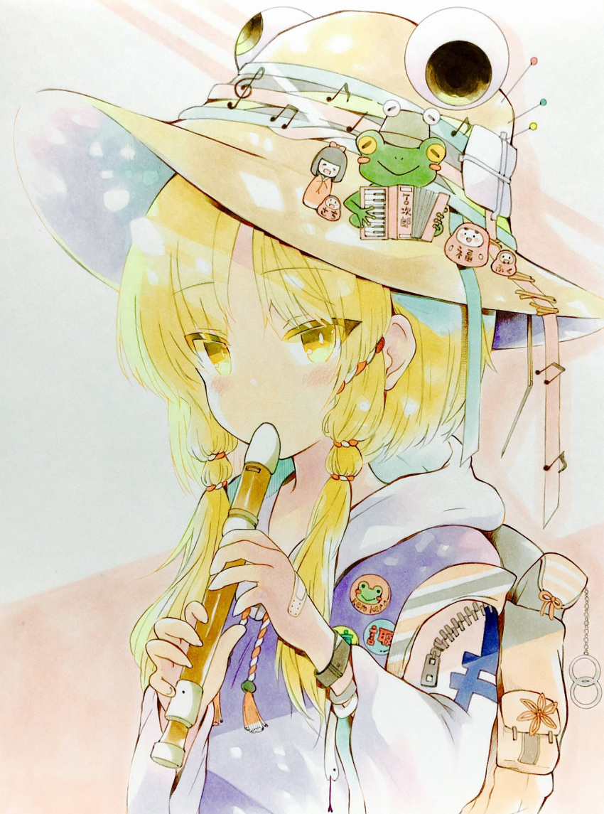 1girl accordion backpack badge bag bandaid bangs beamed_eighth_notes blonde_hair blue_ribbon blush_stickers chain commentary_request daruma_doll doll eighth_note eyebrows_visible_through_hair flute frog green_ribbon hair_ribbon hat hat_ribbon highres hood hoodie instrument long_sleeves looking_at_viewer medium_hair moriya_suwako music musical_note orange_ribbon parted_bangs pin playing_instrument purple_vest quarter_note red_ribbon ribbon snake solo touhou treble_clef trinkets upper_body vest white_hoodie white_snake wristband yellow_eyes yuzugoori zipper