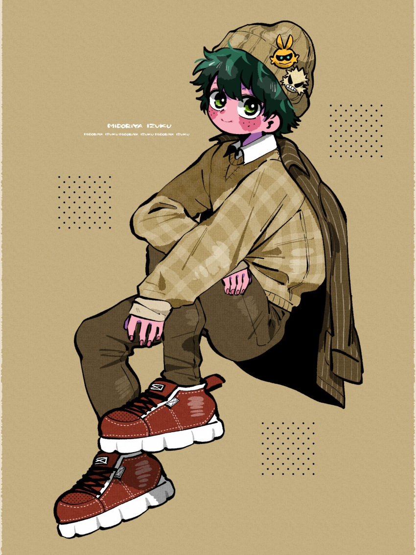 1boy absurdres all_might alternate_costume alternate_skin_color anna_(aannnaa3) arm_on_knee arm_rest bakugou_katsuki beanie boku_no_hero_academia brown_pants casual character_name character_sticker closed_mouth collared_shirt colored_skin commentary cross-laced_footwear eyebrows_hidden_by_hair fingernails freckles from_side full_body green_eyes green_hair hair_between_eyes hands_up hat highres invisible_chair jacket jacket_on_shoulders knee_up light_brown_background long_sleeves looking_at_viewer looking_to_the_side male_focus midoriya_izuku outstretched_arm pants pink_nails pink_skin plaid plaid_sweater polka_dot red_footwear shirt shoes short_hair sitting smile sneakers solo split_mouth sticker sweater white_shirt wing_collar