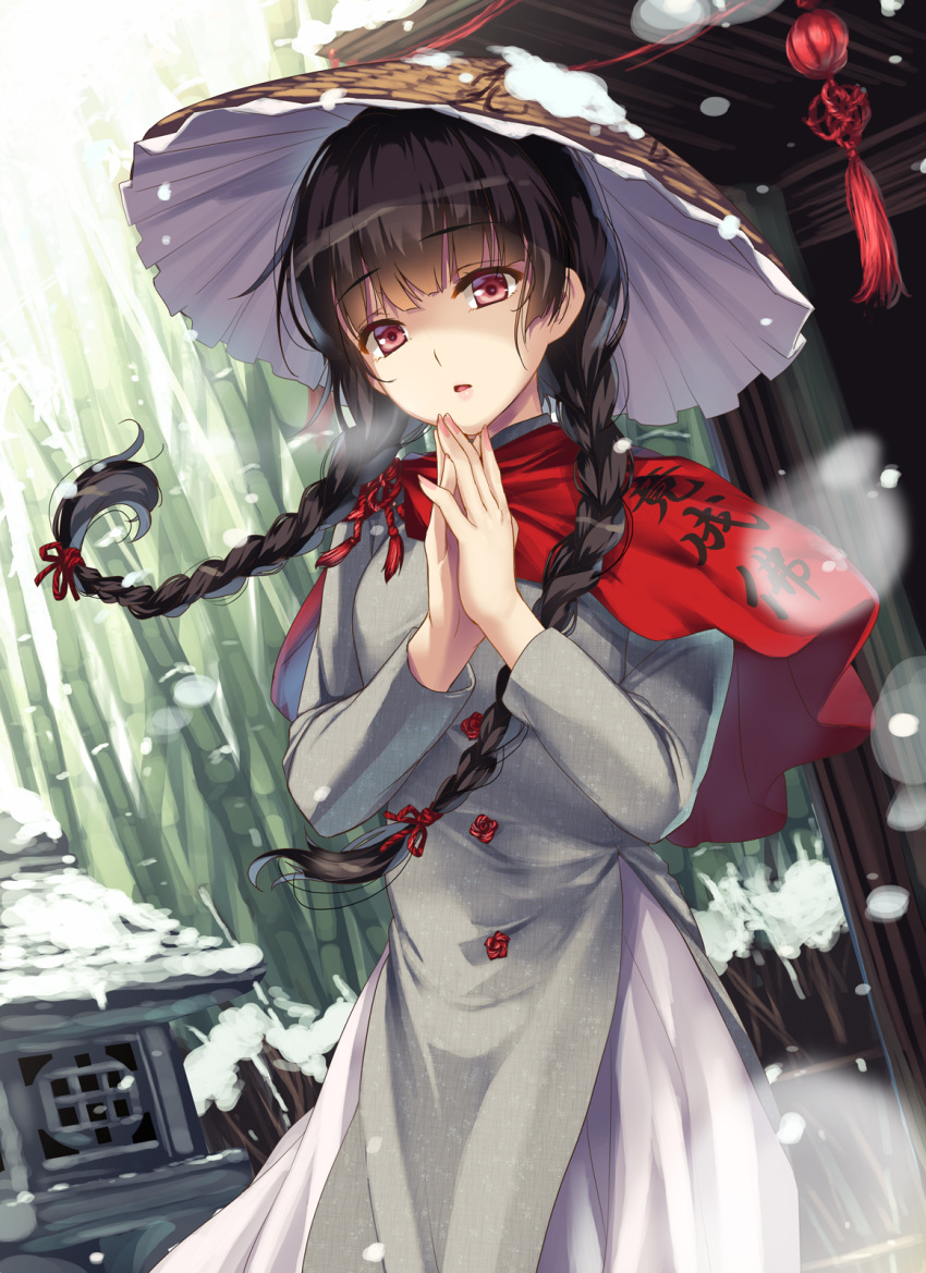 1girl bamboo bamboo_forest bangs black_hair bow braid breasts brown_headwear buttons clothes_writing commentary_request dress eyebrows_visible_through_hair fingernails forest grey_dress hair_bow hands_up hat highres house long_fingernails long_hair long_sleeves looking_at_viewer medium_breasts moneti_(daifuku) nail_polish nature open_mouth own_hands_together pink_nails red_bow red_eyes red_scarf scarf snow snow_on_headwear snowing solo standing tongue touhou twin_braids winter yatadera_narumi