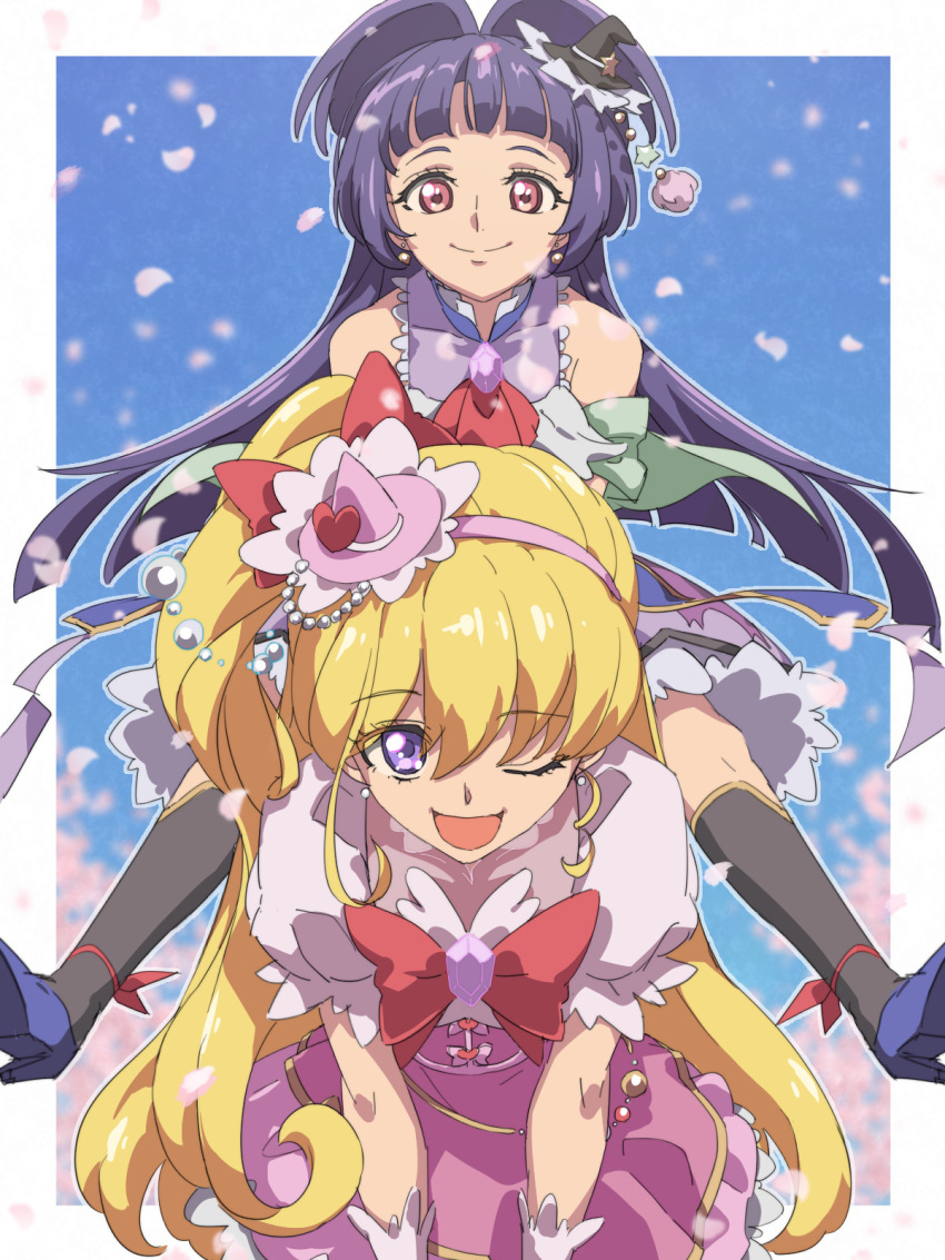 2girls :d arched_bangs asahina_mirai black_hat black_socks blonde_hair blue_background blue_footwear blue_hair border carrying chiharu_(9654784) closed_mouth commentary_request cure_magical cure_miracle dress falling_petals hairband hat highres izayoi_liko long_hair mahou_girls_precure! multiple_girls one_eye_closed open_mouth outside_border petals piggyback pink_dress pink_hairband precure purple_eyes red_eyes smile socks white_border witch_hat