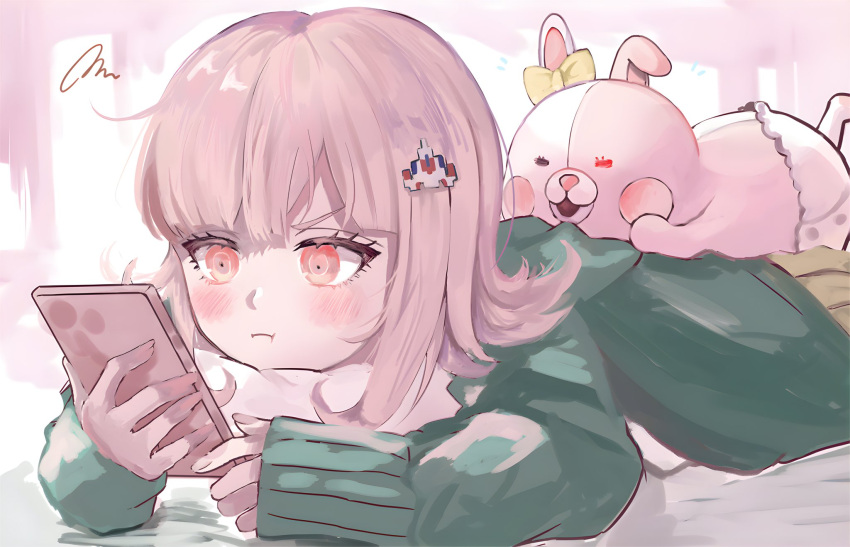 1girl blush bow brown_skirt closed_mouth danganronpa_(series) danganronpa_2:_goodbye_despair ear_bow green_jacket highres holding holding_phone jacket long_sleeves lying medium_hair monomi_(danganronpa) mw_muu_(t0toro_oekaki) nanami_chiaki on_stomach phone pink_eyes pout skirt sleeves_past_wrists solo spaceship_hair_ornament