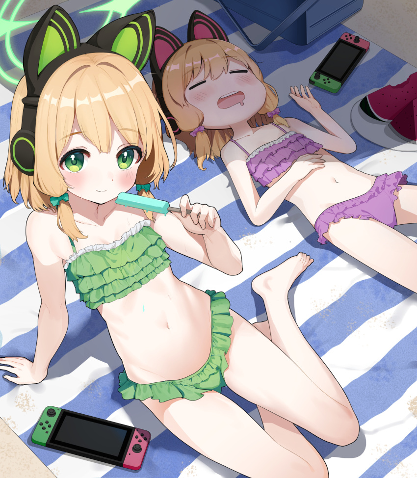 2girls animal_ear_headphones animal_ears arm_support beach_towel bikini blonde_hair blue_archive blush bow cat_ear_headphones drooling fake_animal_ears food frilled_bikini frills fruit green_bikini green_bow green_eyes green_halo hair_bow halo headphones highres holding holding_food holding_popsicle looking_at_viewer low-tied_sidelocks lying midori_(blue_archive) momoi_(blue_archive) mouth_drool multiple_girls navel nintendo_switch on_back open_mouth outdoors p-gnesium pink_bikini pink_bow pink_halo popsicle second-party_source short_hair siblings sisters sitting sleeping smile sunlight swimsuit towel twins watermelon watermelon_slice yokozuwari