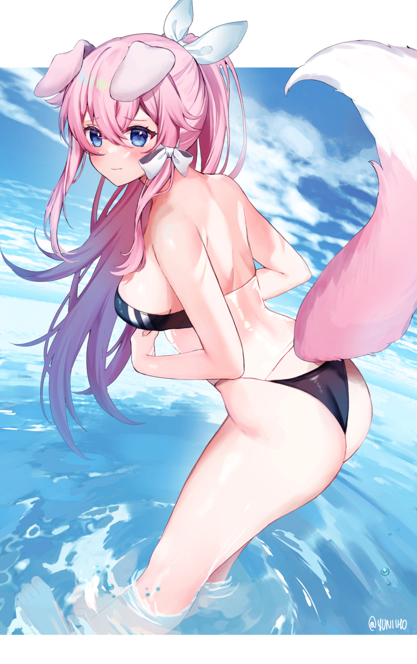 1girl animal_ears ass bangs blue_eyes blush breasts closed_mouth cloud day dog_ears dog_girl dog_tail eyebrows_visible_through_hair from_side gris_swimsuit hair_between_eyes hair_ribbon highres leaning_forward long_hair looking_to_the_side medium_breasts meme_attire ocean one_eye_closed outdoors pink_hair ponytail ribbon see-through solo tail very_long_hair virtual_youtuber vyugen wading water white_ribbon yuniiho yuniiho_(vtuber)