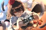  1girl ;d black_feathers black_hair black_skirt black_socks black_wings blurry camera commentary_request depth_of_field feathers full_body hat highres holding holding_camera kaisaikaihai looking_at_viewer one_eye_closed open_mouth pom_pom_(clothes) red_eyes red_hat red_shoes shameimaru_aya shirt shoes short_hair skirt smile socks solo tokin_hat touhou white_shirt wings 