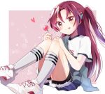  1girl bike_shorts bike_shorts_under_shorts blue_shorts blush border candy commentary_request denim denim_shorts double-parted_bangs food full_body hair_between_eyes heart highres holding holding_candy holding_food holding_lollipop kneehighs knees_up lollipop long_hair looking_at_viewer mahou_shoujo_madoka_magica mahou_shoujo_madoka_magica_(anime) mani_(manidrawings) one_side_up outside_border pink_background print_shirt red_eyes red_hair sakura_kyoko shirt shoes shorts sidelocks simple_background sitting smile socks solo t-shirt tongue tongue_out very_long_hair white_border white_shirt white_shoes 