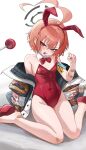  1girl absurdres ahoge angry animal_ears bandaid bandaid_on_arm bandaid_on_foot bandaid_on_knee bandaid_on_leg black_halo blue_archive bow bowtie braid breasts candy chinese_commentary clenched_hand commentary_request covered_navel detached_collar earrings fake_animal_ears food food_in_mouth groin halo hand_up highres huge_ahoge jacket jewelry junsanholo leotard lollipop lollipop_in_mouth looking_at_viewer mole mole_under_each_eye mole_under_eye multiple_moles neru_(blue_archive) neru_(bunny)_(blue_archive) official_alternate_costume open_mouth orange_hair oversized_breast_cup playboy_bunny print_jacket rabbit_ears red_eyes red_leotard short_hair single_braid sitting small_breasts solo strapless strapless_leotard stud_earrings sukajan tag traditional_bowtie wariza white_background 