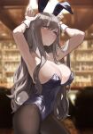  1girl absurdres animal_ears armpits arms_up bangs black_legwear black_leotard blue_eyes blurry blurry_background blush breasts brown_hair cleavage closed_mouth covered_navel cowboy_shot eyebrows_visible_through_hair fake_animal_ears highres large_breasts leotard long_hair looking_at_viewer mole mole_under_eye original pantyhose playboy_bunny rabbit_ears seorang solo 