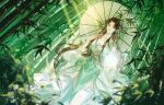  1girl baiguio_(zhu_xian) bamboo bamboo_forest brown_hair chinese_clothes dress flower forest green_dress highres holding holding_umbrella light_rays long_hair looking_at_viewer lotus nature solo sparkle teeth umbrella upper_body zhehua_ran_luyi zhu_xian 