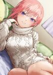  1girl bangs bed_sheet blue_eyes breasts commentary_request dress dutch_angle eyebrows_visible_through_hair fagi_(kakikaki) go-toubun_no_hanayome grey_dress grey_sweater hand_on_hip long_sleeves looking_at_viewer lying medium_breasts nakano_ichika on_bed on_side parted_lips pillow pink_hair short_hair smile solo sweater sweater_dress turtle turtleneck_dress 