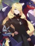  1girl arc_draws black_coat blonde_hair blurry breasts brown_scarf cleavage closed_mouth coat commentary_request cynthia_(pokemon) earrings fur_collar garchomp grey_eyes hair_ornament hair_over_one_eye hand_on_hip highres jewelry long_sleeves looking_at_viewer lucario pokemon pokemon_(creature) pokemon_(game) pokemon_dppt scarf smile v-neck 