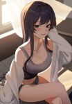  1girl bangs bare_legs black_eyes black_hair blush breasts cleavage crossed_legs curtains dolphin_shorts eyebrows_visible_through_hair head_rest highres indoors jiki_(gkdlfnzo1245) large_breasts long_hair looking_at_viewer navel off_shoulder on_bed original shirt shorts sidelocks sitting sleeves_past_wrists solo sunlight tank_top thighs tongue tongue_out white_shirt 