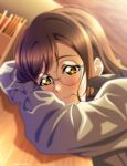  1girl absurdres artist_name bespectacled blush brown_hair closed_mouth glasses grey_shirt hair_in_mouth head_rest highres isami_don kunikida_hanamaru love_live! love_live!_sunshine!! medium_hair round_eyewear shirt solo yellow_eyes 