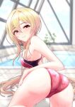  1girl ass ass_focus blonde_hair blurry blurry_background blush competition_swimsuit cyde highres idolmaster idolmaster_cinderella_girls indoors kurosaki_chitose looking_at_viewer looking_back one-piece_swimsuit pool red_eyes solo swimsuit tile_floor tiles 