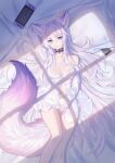  1girl absurdres animal_ears bed_sheet black_choker breasts cellphone choker cleavage extra_ears eyebrows_visible_through_hair fox_ears hair_between_eyes handheld_game_console highres kirby_d_a legs long_hair looking_at_viewer lying medium_breasts navel nintendo_switch on_back original phone pillow purple_eyes revision shirt slit_pupils tail white_hair white_shirt 