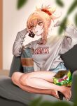  1girl badamon bare_legs barefoot blonde_hair casual character_name chips couch denim denim_shorts eating feet food food_in_mouth full_body genshin_impact hair_ornament hair_scrunchie highres holding holding_phone hood hoodie legs long_sleeves nail_polish on_couch orange_eyes phone pillow ponytail potato_chips red_nails scrunchie shirt shorts toenail_polish toenails toes white_shirt yoimiya_(genshin_impact) 