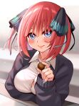  1girl arms_under_breasts bangs black_cardigan black_ribbon blue_eyes blunt_bangs blush breasts butterfly_hair_ornament button_gap cardigan chocolate cleavage elbow_rest elbows_on_table eyebrows_behind_hair food go-toubun_no_hanayome hair_ornament holding holding_food large_breasts looking_at_viewer multicolored_nails nail_polish nakano_nino open_cardigan open_clothes pink_hair ribbon shirt simple_background sleeves_past_wrists smile tairakazuyoshi twintails valentine white_shirt 