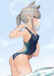  1girl absurdres adjusting_clothes adjusting_swimsuit animal_ear_fluff animal_ears arched_back ass blue_archive blue_eyes blush breasts collarbone competition_swimsuit earrings grey_hair halo highres jewelry leaning_forward looking_at_viewer nuda one-piece_swimsuit shiroko_(blue_archive) sky small_breasts solo stud_earrings swimsuit wading water wet 