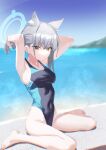  1girl absurdres adjusting_hair animal_ears arms_up bangs barefoot blue_archive blue_eyes blue_sky breasts day ear_piercing erory6_(ro) grey_hair halo highres looking_at_viewer medium_breasts mismatched_pupils mountain ocean one-piece_swimsuit outdoors parted_lips piercing ponytail shiroko_(blue_archive) sitting sky solo swimsuit water wet wet_clothes wet_hair wet_swimsuit 