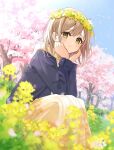  1girl blue_sky blurry blush cherry_blossoms closed_mouth depth_of_field flower green_eyes hair_flower hair_ornament hands_on_own_cheeks hands_on_own_face highres hood hoodie light_brown_hair long_sleeves looking_at_viewer mizuki_(lvo0x0ovl) original outdoors short_hair sitting sky smile solo white_flower yellow_flower 