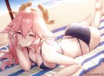  1girl absurdres animal_ears ass azema bare_shoulders beach breasts commentary fox_ears genshin_impact hand_up highres large_breasts long_hair looking_at_viewer lying on_stomach pink_hair purple_eyes smile solo yae_miko 