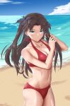  1girl absurdres adjusting_hair bangs bikini black_hair black_ribbon blue_sky breasts cleavage closed_mouth cloud day fate/stay_night fate_(series) friskkle green_eyes hair_ribbon halterneck hands_up highres long_hair looking_at_viewer medium_breasts navel ocean outdoors parted_bangs red_bikini ribbon sand sky solo stomach swimsuit tohsaka_rin two_side_up 