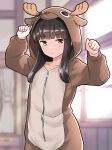  1girl animal_costume animal_hood antlers black_hair blunt_bangs blurry blurry_background brown_eyes fake_antlers flat_chest furaggu_(frag_0416) hatsuyuki_(kancolle) highres hime_cut hood indoors kantai_collection long_hair long_sleeves onesie reindeer_antlers reindeer_costume reindeer_hood solo standing window 