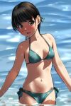  1girl absurdres bikini black_hair breasts brown_eyes cowboy_shot green_bikini highres long_hair looking_at_viewer matsunaga_kouyou original polka_dot polka_dot_bikini side-tie_bikini small_breasts smile soaking_feet solo standing swimsuit water wet wet_clothes wet_swimsuit 