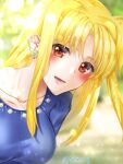  1girl bangs blonde_hair blue_shirt blurry blurry_background blush commentary_request day depth_of_field earrings fate_testarossa highres jewelry leaning_forward leonis_g long_hair looking_at_viewer lyrical_nanoha open_mouth outdoors red_eyes shirt smile solo sunlight twitter_username 