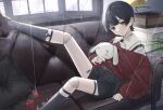  1boy black_hair closed_mouth coat couch doll_joints highres joints k_shinbunshi legwear_garter long_sleeves looking_at_viewer male_focus original red_eyes short_hair shorts sitting socks solo stuffed_animal stuffed_bunny stuffed_toy suspenders 