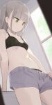  1girl arm_support black_bra black_panties blunt_bangs bra breasts closed_mouth collarbone commentary_request green_eyes grey_hair grey_shorts highres hiroki_(yyqw7151) indoors navel original panties panties_under_shorts short_hair shorts small_breasts solo standing thighs underwear window 