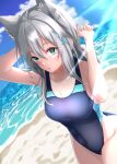 1girl :o absurdres animal_ears aqua_eyes bangs bare_arms bare_shoulders blue_archive blue_swimsuit blush breasts cat_ears cleavage core1013 covered_navel cross_hair_ornament grey_hair hair_ornament hands_up highres large_breasts long_hair looking_at_viewer ocean one-piece_swimsuit outdoors parted_lips shiroko_(blue_archive) shiroko_(swimsuit)_(blue_archive) sky solo swimsuit water 