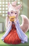  1girl absurdres animal_ear_fluff animal_ears blush box brown_hair closed_mouth commentary_request folded_ponytail fox_ears fox_girl fox_tail gift gift_box hair_between_eyes hakama hakama_skirt hands_up heart-shaped_box highres holding holding_gift indoors iroha_(iroha_matsurika) japanese_clothes kimono koyoi_(iroha_(iroha_matsurika)) long_hair long_sleeves looking_at_viewer miko on_floor original purple_eyes red_hakama round_window seiza sitting skirt smile solo tail tatami valentine very_long_hair white_kimono wide_sleeves window 